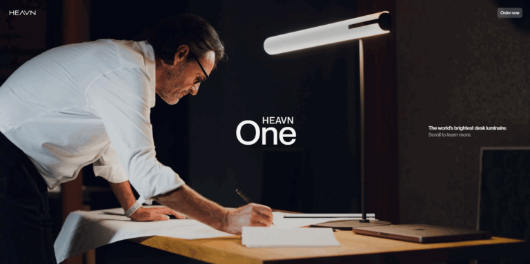 Designer working at desk with Office screen – modern workspace concept